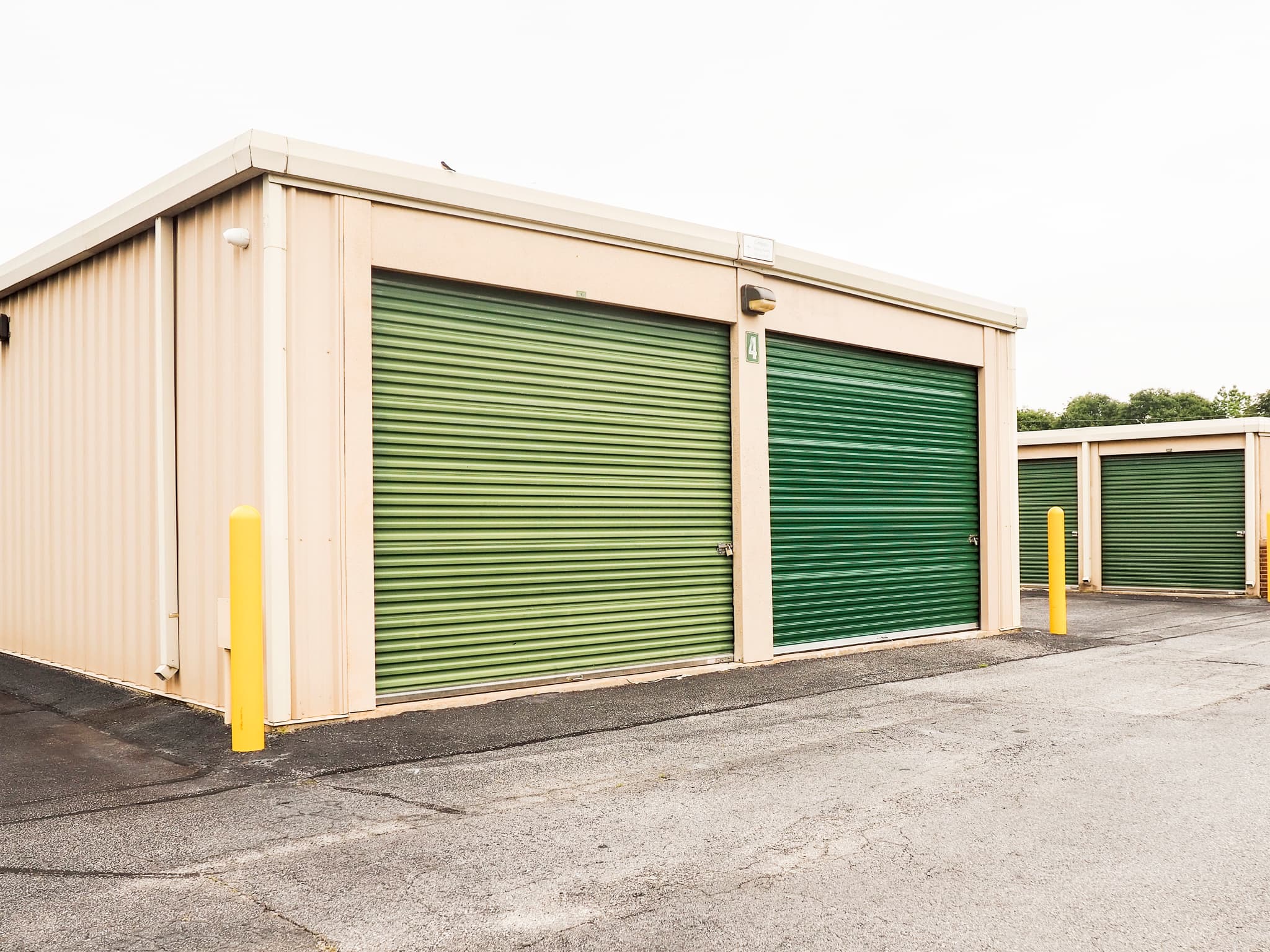 Large drive-up storage units with green doors